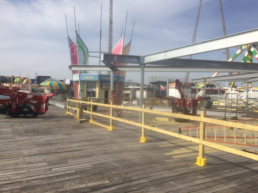 Crane lifting galvanized steel on the boardwalk