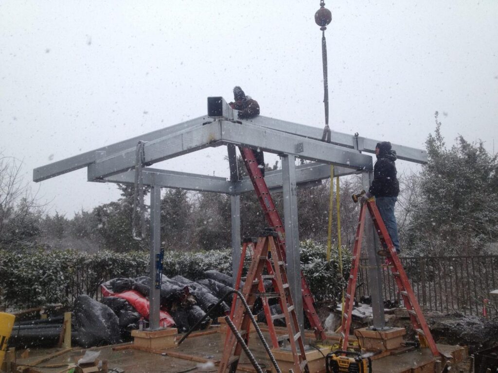 Crane lifting galvanized steel on the boardwalk