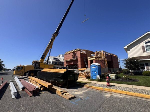 Grove GMK4115 lifting steel on a home or commercial job