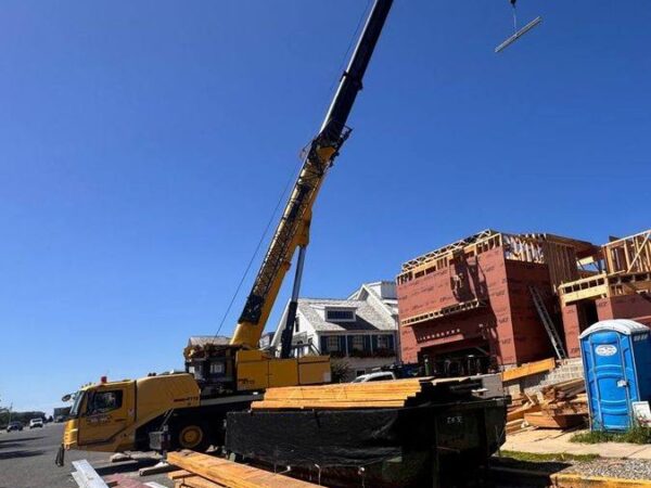 Grove GMK4115 lifting steel on a home or commercial job