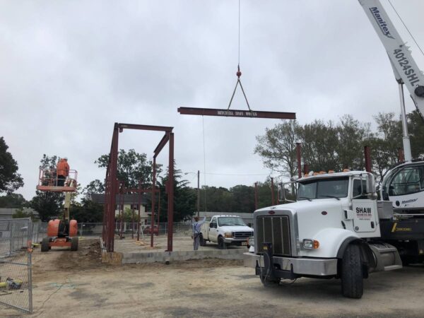 Manitex 40124SHL boom truck lifting steel on a commercial job