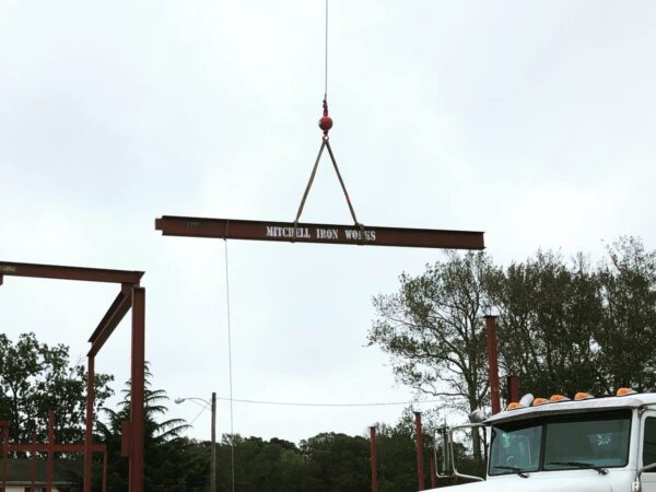 Manitex 40124SHL boom truck lifting steel on a commercial job