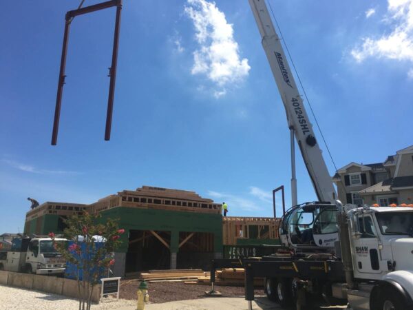 Manitex 40124SHL boom truck setting structural steel