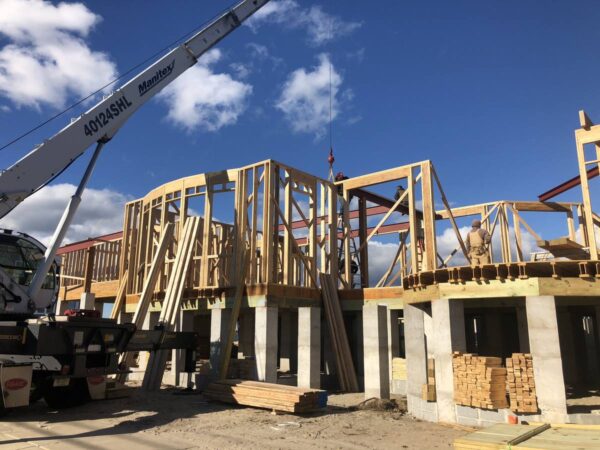Manitex 40124SHL boom truck setting structural steel