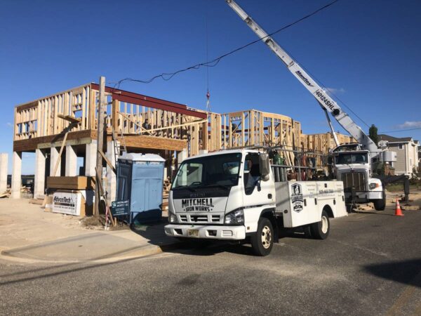 Manitex 40124SHL boom truck setting structural steel